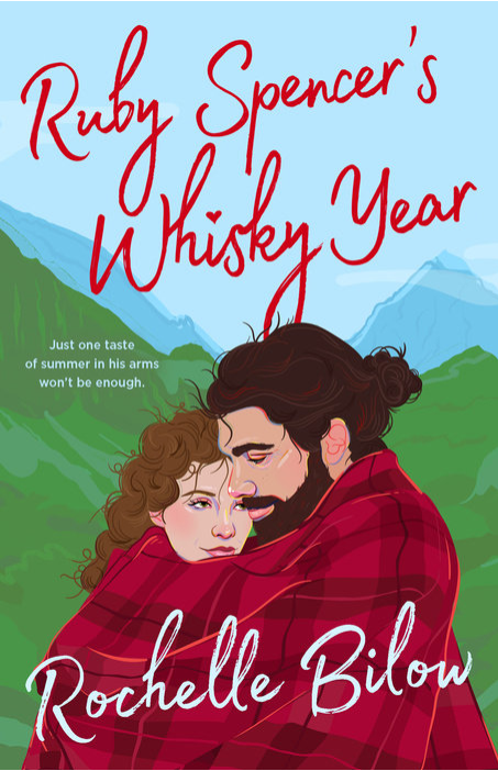 Ruby Spencer's Whisky Year by Rochelle Bilow. Just one taste of summer in his arms won't be enough. An illustration of a man and woman holding each other and wrapped in a red plaid blainket with green mountains and a blue sky in the background.